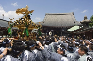 Mikoshi portable shrine of the gods parade and crowds of people