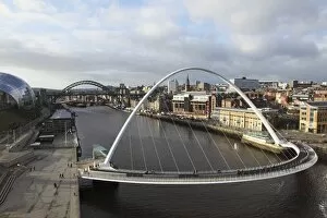 Millennium Bridge Collection: Millennium Bridge and Tyne Bridge span the River Tyne, from Gateshead to Newcastle, Tyne and Wear