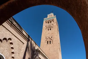 Middle Prints: Minaret of Koutoubia Mosque stands tall against blue sky in Marrakech