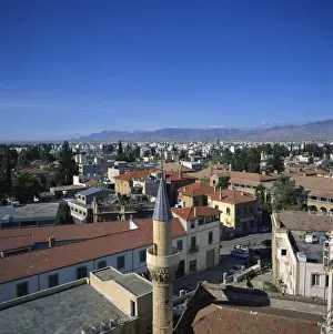 Kyrenia Prints: Minaret and skyline of Turkish Cypriot North Nicosia with Kyrenia mountains in distance