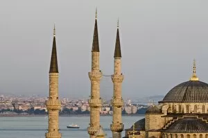 Minarets and dome of Blue Mos que with Bos phorus in background, Is tanbul, Turkey, Europe