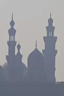 Images Dated 7th November 2009: The minarets of the mosques of the old city in the smog, Cairo, Egypt, North Africa