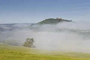 Bourgogne Prints: Mist clears away from around the hilltop village of Vezelay in the Yonne area of Burgundy