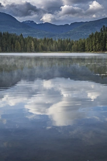 Mist on Lost Lake, Ski Hill and surrounding forest, Whistler, British Columbia, Canada