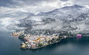 Old Towns Prints: Mist over Varenna old town and Lake Como after a snowfall in winter, aerial view