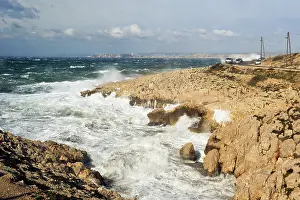Vehicles Prints: Mistral wind creates waves on rocky coast near road in Marseille