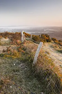 Fences Prints: A misty dawn on the countryside surrounding Corfe Castle village