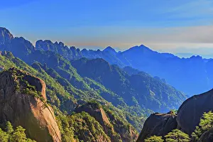 Vista Prints: Misty mountain scapes of Huangshan reveal rocky peaks and lush forests in Anhui Province