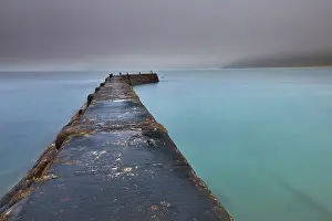 Cove Prints: A misty, murky dawn view of the breakwater at Sennen Cove; on the Atlantic coast near Land's End