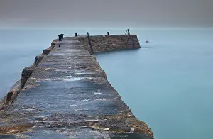 Cove Prints: A misty, murky dawn view of the breakwater at Sennen Cove; on the Atlantic coast near Land's End