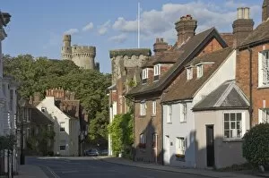 West Sussex Collection: Mixed red brick dwellings approaching Arundel Castle, Arundel, West Sussex, England