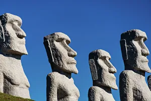 Cemeteries Prints: Moai statues against a blue sky