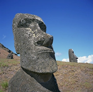 Moai statues carved from crater walls, on the southern slopes of Volcan Rano Raraku