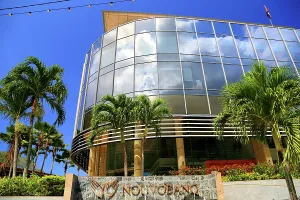 Economy Prints: Modern building design with glass facade in Victoria, Seychelles during a sunny day