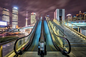 Shanghai Prints: A modern, open-air escalator with Pudong cityscape at night, Shanghai, China, Asia