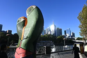 Riverfront Prints: Modern sculpture and city skyline