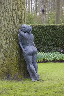Holland Prints: Modern sculpture of nude couple embracing, Keukenhof, park and gardens near Amsterdam