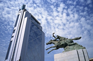 Modern skyscraper and statue show contrast of the old and the new, Santiago