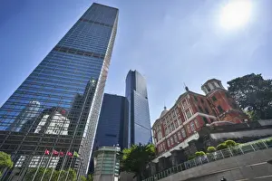 Colonial Style Prints: Modern skyscrapers stand next to the colonial Former French Mission Building in Central
