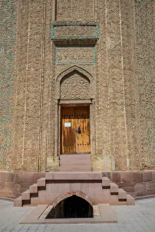 Tomb Prints: Momine Khatun Mausoleum shows intricate stonework and a wooden door in Nakhchivan