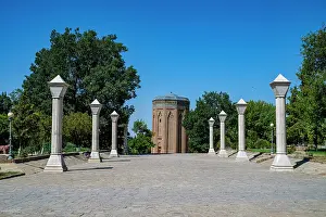 Columns Prints: Momine Khatun Mausoleum stands amidst tall trees and stone columns in Nakhchivan