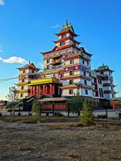 Spiritual Prints: Monastery building stands tall against the blue sky in Kyzyl