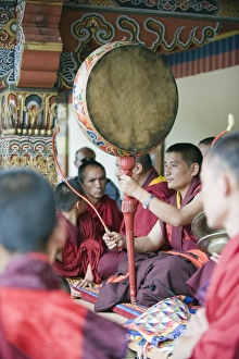 Monk with drum, Autumn Tsechu (festival) at Trashi Chhoe Dzong, Thimpu, Bhutan, Asia Monk with drum, Autumn Tsechu (festival) at Trashi Chhoe Dzong, Thimpu, Bhutan, Asia