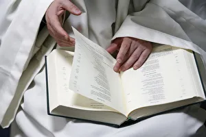 Evian Prints: Monk reading the Bible, Evian, Haute Savoie, France, Europe