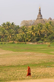 Mrauk U Prints: Monk walking past Zina-man-aung paya, Mrauk U, Myanmar (Burma), Asia