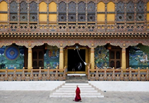 Bhutan Prints: Monk walking through Punakha Dzong, Punakha District, Bhutan, Asia