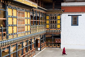 Bhutan Prints: Monk walking through Rinpung Dzong, Paro District, Bhutan, Asia