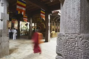Monk walking in Temple of the Tooth (Sri Dalada Maligawa), Kandy, Sri Lanka, Asia