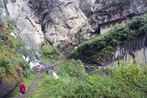 A monk on his way to Tigers Nest (Taktsang Goemba), Paro Valley, Bhutan, Asia A monk on his way to Tigers Nest (Taktsang Goemba), Paro Valley, Bhutan, Asia