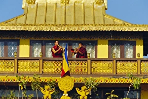 Balcony Prints: Monks blowing Tibetan horns on the roof the Sakyapa gompa