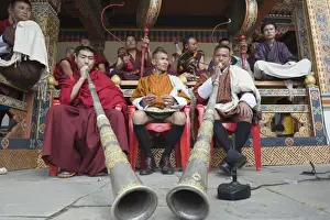 Tsechu Prints: Monks playing horns and drums, Autumn Tsechu (festival) at Trashi Chhoe Dzong