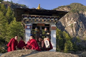 Monks on their way up to the Tiger Nest (Taktshang Goempa) monastery, Bhutan, Asia Monks on their way up to the Tiger Nest (Taktshang Goempa) monastery, Bhutan, Asia