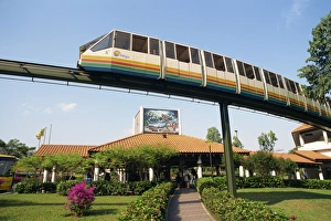 Mono Rail Prints: Monorail passes above Underwater World on Sentosa Island