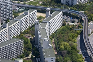 Monorail train weaving through housing development on Sakishima Island, Osaka, Japan Monorail train weaving through housing development on Sakishima Island, Osaka, Japan
