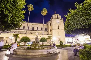 Monreale Cathedral at night, Sicilian people at the fountain in Guglielmo Square, Monreale, near Palermo, Sicily, Italy, Europe