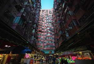 Bustling Prints: Monster Buildings and market during dusk, Quarry Bay. Hong Kong, China