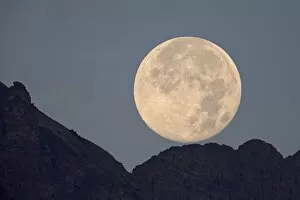 Glacier National Park Gallery: Full moon setting above a ridge, Glacier National Park, Montana, United States of America