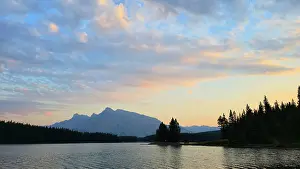 Alberta Prints: Moonlight reflects on Jack Lake with distant mountains in Banff, Alberta, Canada