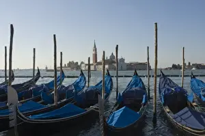 Gondolas Prints: Moored gondolas and the island church of San Giorgio Maggiore