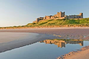 Northumbria Collection: Morning light on the beach at Bamburgh Castle, Northumberland, England