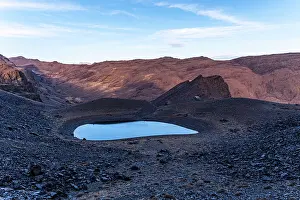 Glacial Prints: Morning light illuminates a glacial tarn beneath Cerro del Caballo in Sierra Nevada National Park