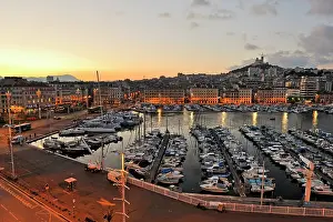 Vehicles Prints: Morning light reflects on the Old Port and boats under the Basilica Notre-Dame de la Garde in Marseille