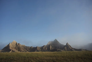 Morning mist rises in Badlands National Park, South Dakota, United States of America Morning mist rises in Badlands National Park, South Dakota, United States of America