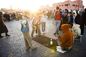 Boys Prints: Moroccan people playing street games in Place Djemaa El Fna