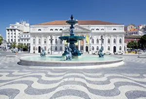Mosaic paving and fountain with Lisbon Opera House in the background
