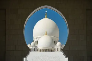 View Through Prints: A mosque is framed by an arched passageway in Abu Dhabi, United Arab Emirates, Middle